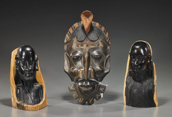 Three Various African Wood Carvings: Three Various African Wood CarvingsGroup of 3 African wood carvings from Kenya: pair ebony portrait busts of a man and woman, showing the natural wood bark on the verso; together with a stylized mask,