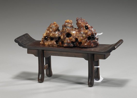Chinese Soapstone Brushrest & Hardwood Stand: Chinese Soapstone Brushrest & Hardwood Stand Chinese carved multi-colored soapstone mountain-form brushrest with some openwork; together with a hardwood altar table form stand; L: 9 1/4" (larger)