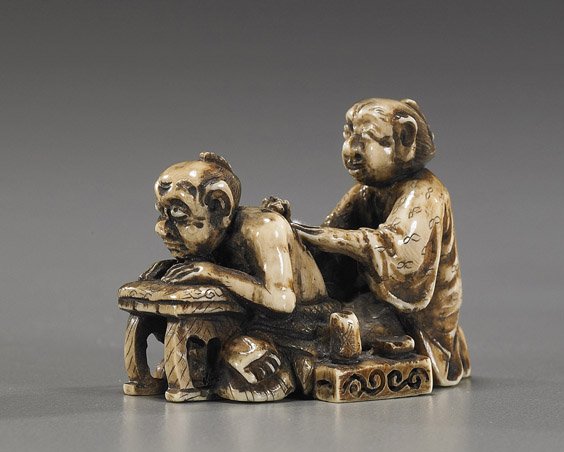 Carved Ivory Figural Netsuke: Carved Ivory Figural Netsuke Unusual carved and stained ivory netsuke; of a kneeling figures working on the back of another figure bent over table, signed; Provenance: de-accessioned from Los Angeles 