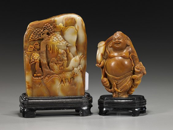 Two Chinese Sealstone Carvings: Two Chinese Sealstone Carvings Two Chinese sealstone carvings: the larger somewhat mountain form with sages in a landscape, dark and light yellow color; together with standing Budai holding a scepter 