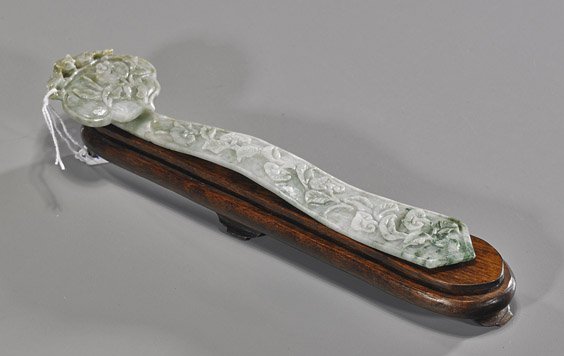 Chinese Carved Jadeite Small Scepter: Chinese Carved Jadeite Small Scepter Chinese carved jadeite small scepter; ruyi form with allover relief carvings, ruyi and foliage to the body, pomegranate and openwork bat to the head, mottled green