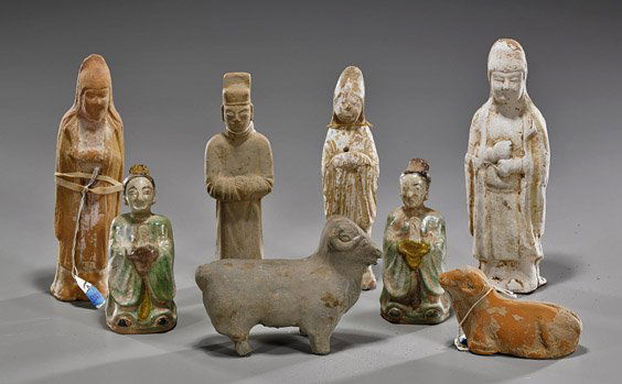 Group of Eight Early Chinese Ceramics: Group of Eight Early Chinese CeramicsGroup of 8 early Chinese ceramics, including: 4 Sui and early Tang Dynasty standing figures, 2 Song slightly iridescent glazed figures; and 2 rams: one Han Dynasty