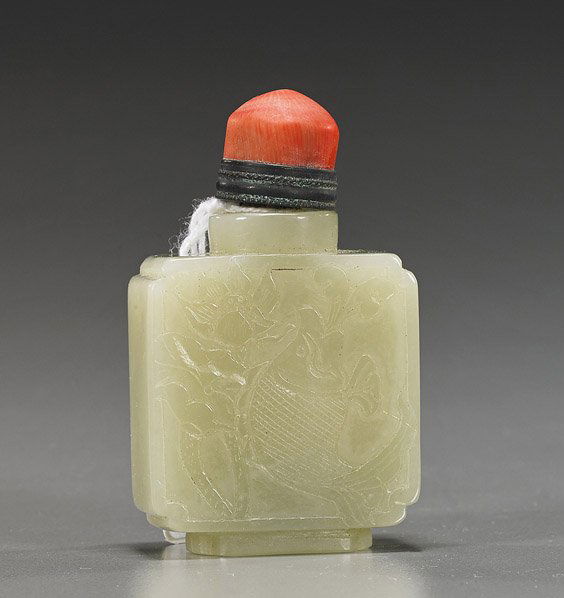Chinese Carved Celadon Jade Snuff Bottle: Chinese Carved Celadon Jade Snuff BottleFinely hollowed, Chinese carved celadon jade snuff bottle; square form with fish and lotus relief to the front, double gourds to the back, metal mounted stopper