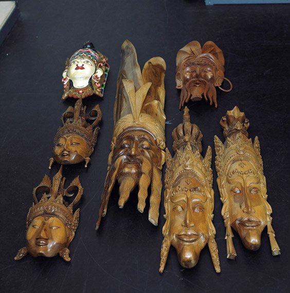 Group of 7 Indonesian Carved Wood Masks: Group of 7 Indonesian Carved Wood Masks Group of 7 Indonesian carved wood masks: 6 Balinese, probably rosewood: pair with openwork crowns; very tall bearded; bearded and wearing loose ring earrings (o