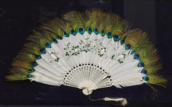 Old Chinese Peacock Feather Fan: Old Chinese Peacock Feather Fan Old Chinese fan; comprised of white feathers painted with design of flowering plants and butterfly, bordered by peacock feathers and with openwork carved bone framework