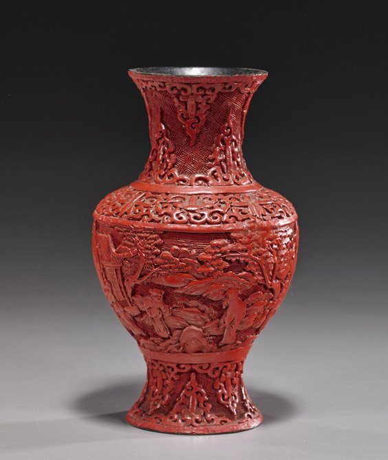Chinese Carved Cinnabar Lacquer Vase: Chinese Carved Cinnabar Lacquer VaseEarly 20th Century, Chinese carved cinnabar lacquer vase; of baluster form with continuous figural landscape and scrolling florals (flaws and wear); H: 8"