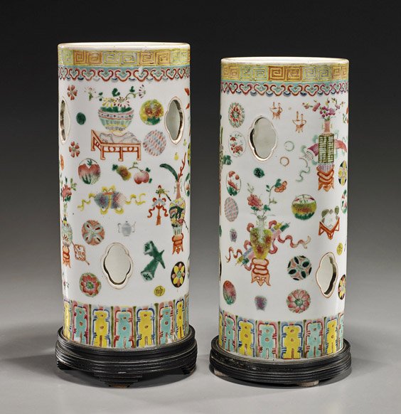 Pair Antique Chinese Porcelain Hat Stands: Pair Antique Chinese Porcelain Hat Stands Pair antique Chinese porcelain hat stands; each cylindrical with some openwork and with Famille Rose precious vessel designs and floral medallions (drilled an