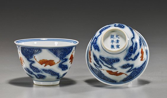 Pair Chinese Porcelain Teabowls with Bats: Pair Chinese Porcelain Teabowls with Bats Pair Chinese, Qing-style blue and white porcelain tea bowls; each with coral red bats among clouds, the interior with matching medallion, 6-character marks; D