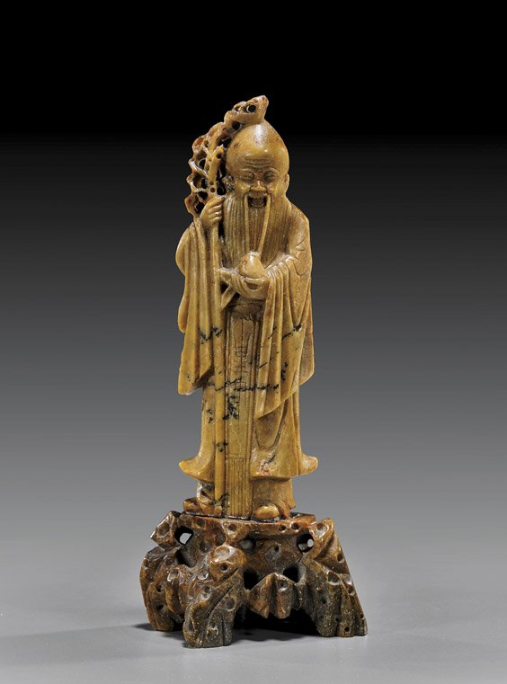 Old Chinese Carved Soapstone Shoulao: Old Chinese Carved Soapstone Shoulao Old Chinese carved soapstone figure of Shoulao; standing with a tall staff and carrying a peach, on a matching soapstone base (flaws); H: 9 3/4"