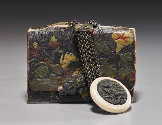 Antique Japanese Tobacco Pouch & Netsuke: Antique Japanese Tobacco Pouch & Netsuke Antique Japanese carved and lacquered leather tobacco pouch; with allover floral motifs and dragon clasp; the dragon manju netsuke in celluloid and metalwork (