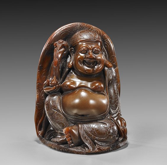 Heavy Chinese Carved Soapstone Budai: Heavy Chinese Carved Soapstone Budai Heavy Chinese carved soapstone Budai; seated and holding a ruyi scepter, incised florals to his robes and with mandorla, consistent deep brown color to stone; H: 8