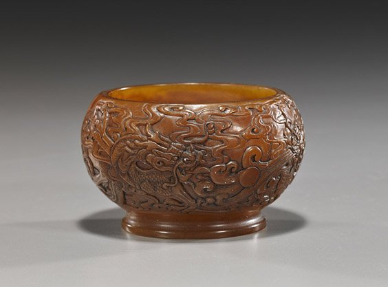 Chinese Carved Soapstone Dragon Vessel: Chinese Carved Soapstone Dragon Vessel Unusual Chinese carved soapstone globular footed vessel; with elaborate relief designs of dragons contesting a pearl, seal mark (natural inclusions); D: 3 1/2"