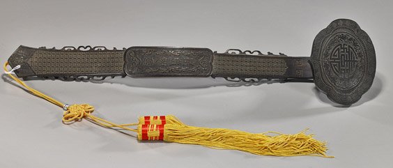 Chinese Carved Wood Ruyi Scepter: Chinese Carved Wood Ruyi Scepter Chinese carved wood ruyi scepter; with longevity designs and Shou motif surrounded by bats to the head, and with character plaque on patterned ground to the body, silk