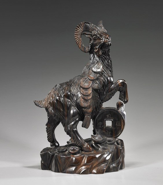Large Chinese Carved Hardwood Ram: Large Chinese Carved Hardwood Ram Tall and heavy Chinese carved fine hardwood, possibly zitan, model of a ram; standing on rockery with one leg resting on a large coin: with string of cash and ruyi in