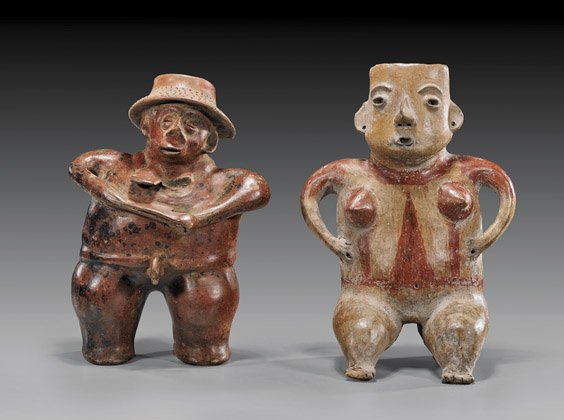Two Pre-Columbian Pottery Figures: Two Pre-Columbian Pottery Figures Two Mexican Pre-Columbian pottery figures: seated female with curved arms and hands resting on her hips, openwork featured; and a standing man wearing a hat and holdi