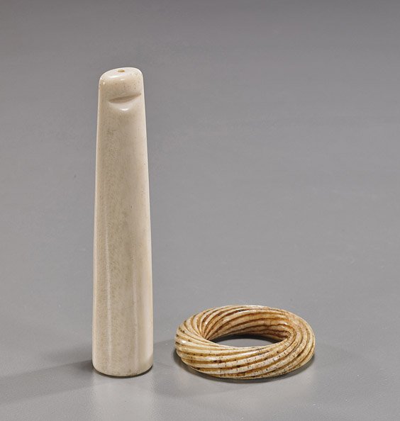 Two Various Chinese Ivories: Two Various Chinese Ivories Two Chinese ivories: circular ring with grooved spiral design (small chip); together with a plain form cigarette holder; L: 4" (longer)