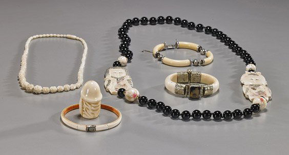 Group of Various Ivory Jewelry: Group of Various Ivory JewelryGroup of various ivory jewelry, including: carved and polychromed scrimmed boy and girl pendants strung on a necklace of black hardstone beads; silver mounted sectional b