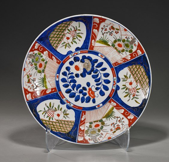 Antique Japanese Imari Porcelain Charger: Antique Japanese Imari Porcelain Charger Antique Japanese Imari porcelain charger; with typical floral panels around a central medallion of blossoms and foliage (some wear, rim chip), Circa 1900; D: 1