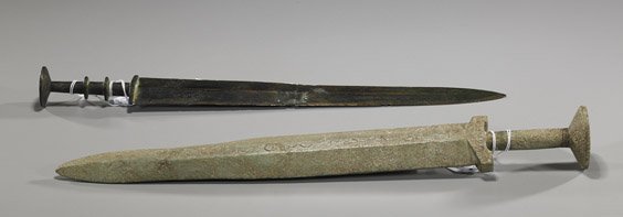 Two Chinese Swords: Bronze & Hardstone: Two Chinese Swords: Bronze & Hardstone Two Chinese swords, including: archaic bronze Warring States/Han Dynasty (cleaned and repaired); together with an archaistic carved hardstone with incised scroll