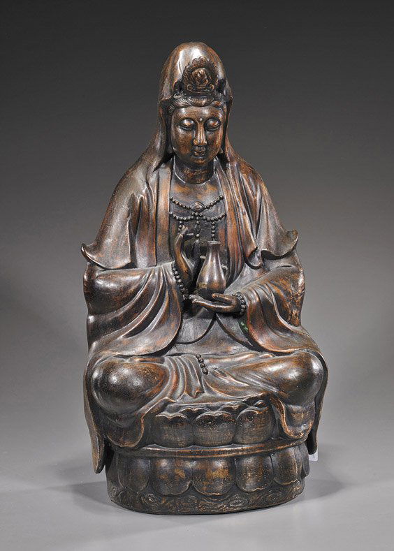 Tall Chinese Bronze Figure of Guanyin: Tall Chinese Bronze Figure of GuanyinChinese coppery bronze figure of Guanyin; seated on a raised lotus base, wearing long robes and veil, and holding her vase in one hand, the other hand in mudra (so