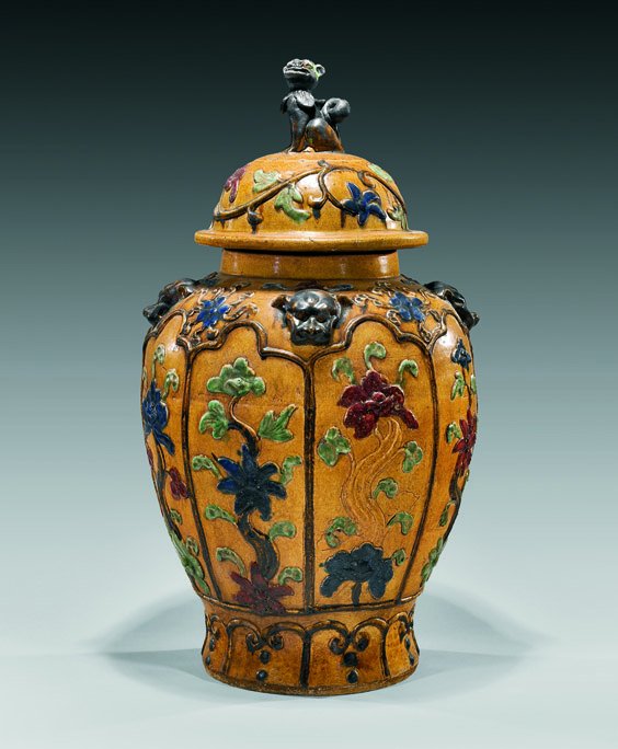 Large Chinese Glazed Stoneware Jar: Large Chinese Glazed Stoneware JarLarge Chinese Provincial, polychrome-glazed stoneware jar and cover: of somewhat baluster form with floral panels; lion masks at the shoulder and lion finial (small f