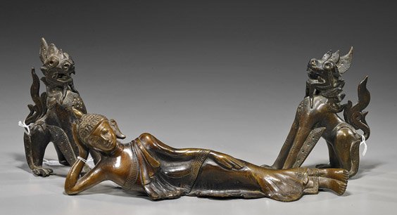 Three Various Southeast Asian Bronzes: Three Various Southeast Asian Bronzes Three Southeast Asian bronzes: pair antique, probably Burmese, seated lions baring their teeth and with flanges at their legs; together with an old Thai reclining