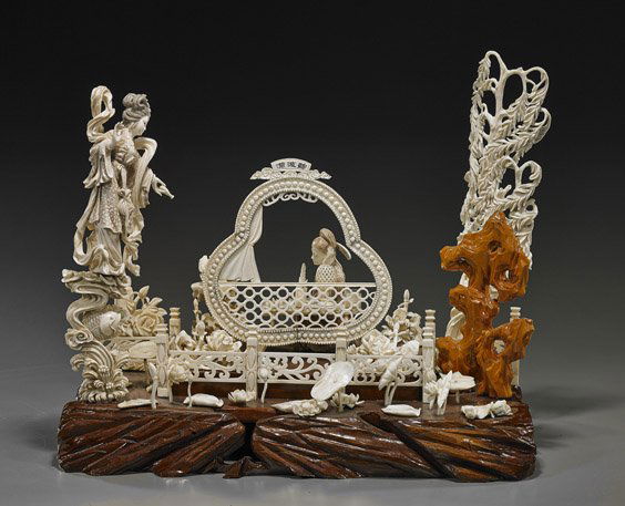 Elaborate Chinese Sectional Ivory Group: Elaborate Chinese Sectional Ivory GroupElaborate Chinese sectional carved ivory group; with Guanyin standing above a fish and waves, and pouring from her bottle; and with a scholar seated at his desk,
