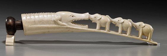 African Ivory Tusk: Alligator & Elephants: African Ivory Tusk: Alligator & Elephants Early 20th Century African carved ivory tusk "bridge"; with three elephants with raised trunks facing a large alligator with open mouth, inlaid eyes; L: 13 1/