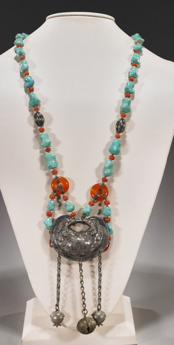 Chinese Turquoise Nugget Bead Necklace: Chinese Turquoise Nugget Bead Necklace Chinese necklace of turquoise nugget beads; with carnelian agate and coral, the antique pendant in repoussé silver with characters and pending pomegranate form 