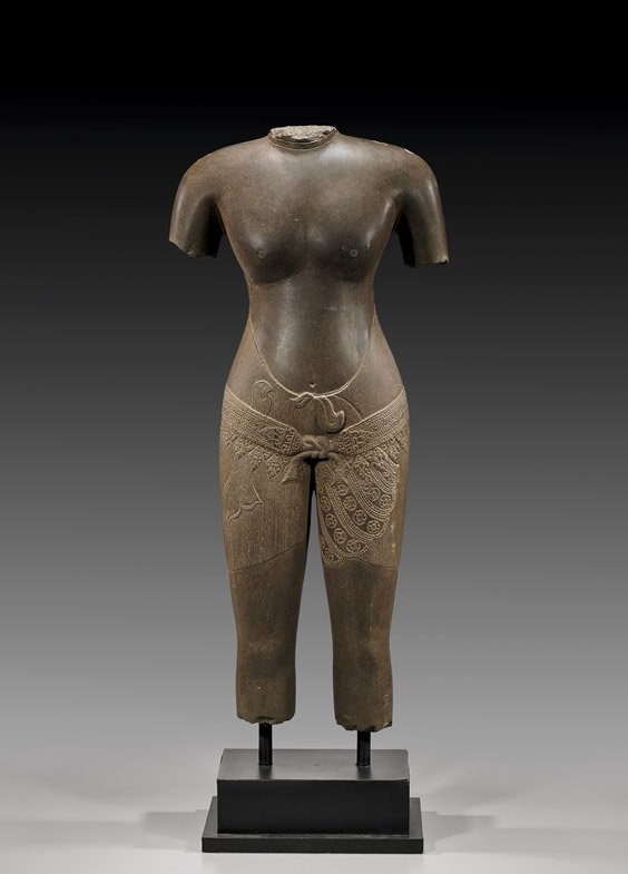 FINE SOUTHEAST ASIAN STONE TORSO: 南亞石雕軀幹半身像 FINE SOUTHEAST ASIAN STONE TORSO Finely carved and polished, Southeast Asian stone torso; in typical fragmentary state with an 