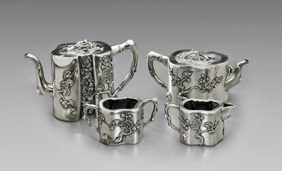 FOUR ANTIQUE REPOUSSÉ EXPORT SILVER TEA SET: 外銷銀質梅花紋茶具組 四件 ANTIQUE REPOUSSÉ EXPORT SILVER TEA SETAntique Chinese repoussé Export silver, four-piece tea set by