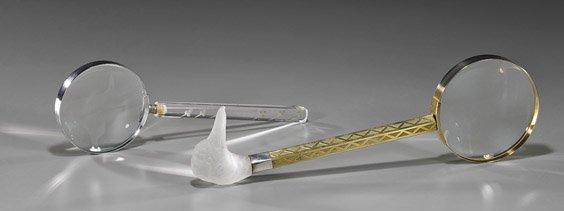 Two Large Old Magnifying Glasses: Two Large Old Magnifying Glasses Two early 20th Century magnifying glasses: larger with parcel gilt hexagonal handle and frosted glass duck head end (small chip); the shorter with lucite handle with f