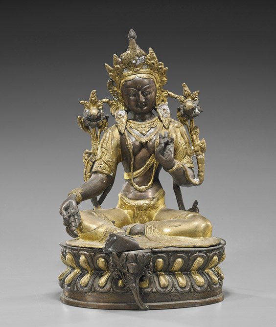 Nepalese Parcel Gilt Bronze Seated Deity: Nepalese Parcel Gilt Bronze Seated Deity Nepalese parcel gilt bronze figure of a deity; seated on a lotus pedestal and wearing elaborate jewelry and headdress, hands in mudra; H: 12"