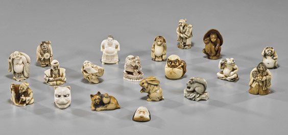 Group of 18 Old Carved Ivory Netsuke: Group of 18 Old Carved Ivory Netsuke Group of 18 old carved ivory netsuke: amusing frog on lotus; standing badger with hat and lantern; squirrel on log, inlaid eyes; cat with ball; bagger with protrud