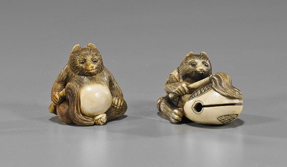 Two Carved Ivory Badger Netsuke: Two Carved Ivory Badger NetsukeTwo Circa 1900, carved and parcel stained ivory badger netsuke: one seated and holding a whisk with a mokugyo drum; the other seated with belly protruding and holding a