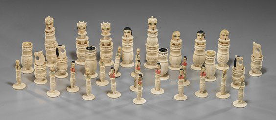 Unusual Old Carved Bone Chess Set: Unusual Old Carved Bone Chess SetUnusual carved and polychromed bone chess set; comprised of 32 pieces, some with human heads, some vessels, all with carved designs, early 20th Century; L: 12" (talles