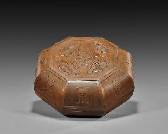 Unusual Chinese Octagonal Wood Box: Unusual Chinese Octagonal Wood Box Unusual, Chinese wood box; of octagonal form, with four bats centering a Shou medallion, flanked with Shou characters to each panel, and with lotus petal border to b