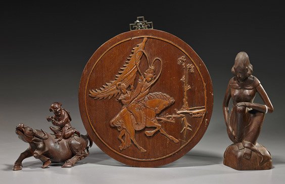 Three Various Asian Wood Carvings: Three Various Asian Wood Carvings Three various wood carvings: Balinese nude woman crouching on a rock; Chinese boy seated on a buffalo in repose (chipped horn); and a circular plaque with relief of a