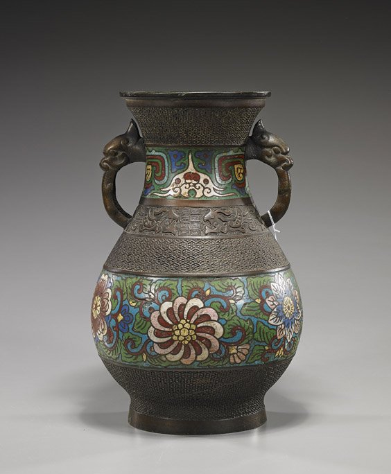 Antique Japanese Champlevé Enamel Vase: Antique Japanese Champlevé Enamel VaseAntique Japanese champlevé enamel on bronze vase; baluster form with bands of florals and archaistic scrolling motifs, two animal head handles (minor flaws), Ci