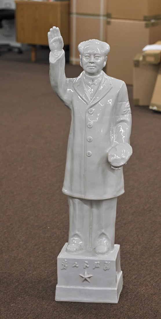 Tall Chinese White-ware Porcelain Mao: Tall Chinese White-ware Porcelain Mao Tall Chinese white-ware glazed model of Mao; standing on a rectangular platform with moulded inscription: wearing a long coat and pants, and with his cap in one h