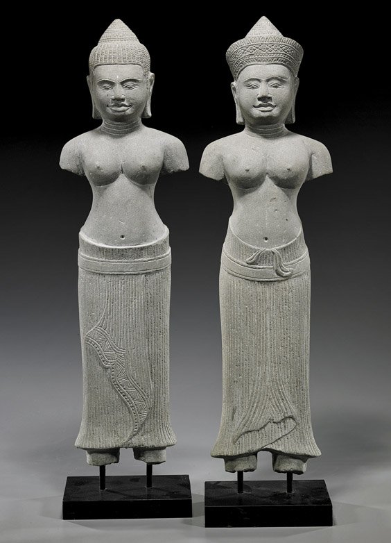 Pair Cambodian Carved Sandstone Figures: Pair Cambodian Carved Sandstone Figures Pair Cambodian Khmer-style carved sandstone figures; each standing partially clothed in skirts and each with a different headdress (usual losses); H: 23 1/2" (e
