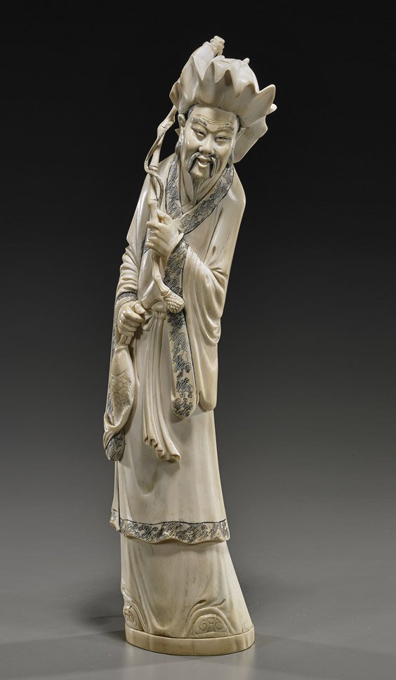 Tall Old Chinese Ivory Fisherman Immortal: Tall Old Chinese Ivory Fisherman Immortal Tall and well executed, early 20th Century Chinese carved ivory figure of a fisherman Immortal; standing in long robes and wearing a brimmed hat, holding a ba