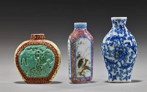 Three Chinese Porcelain Snuff Bottles: Three Chinese Porcelain Snuff Bottles Three Chinese porcelain snuff bottles: Qianlong-style yellow and blue-green glazed with moulded figural scenes (some wear, no top); together with Qianlong-style r