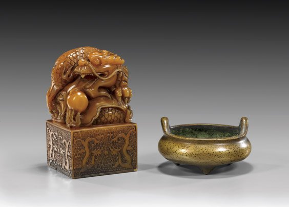 SOAPSTONE DRAGON SEAL & BRONZE CENSER: 皂石印章及銅香爐 SOAPSTONE DRAGON SEAL & BRONZE CENSER Chinese carved soapstone dragon seal: of a writhing dragon curled into itself with a flaming pear