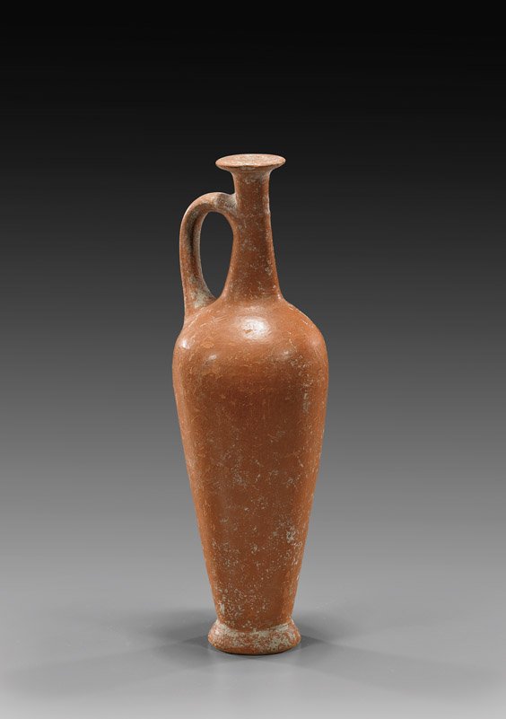 ANCIENT SYRIAN POTTERY FLASK: 古叙利亚陶壶 ANCIENT SYRIAN POTTERY FLASK Ancient Syrian Bronze Age pottery flask; of tall slim tapered form, with a single handle at the shoulder, and flared rim; 