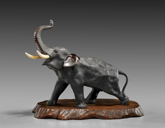 ANTIQUE JAPANESE BRONZE ELEPHANT: 日式銅雕象置物 ANTIQUE JAPANESE BRONZE ELEPHANT Antique Japanese two-toned bronze elephant; rendered with attractively textured "skin", throwing its trunk up 