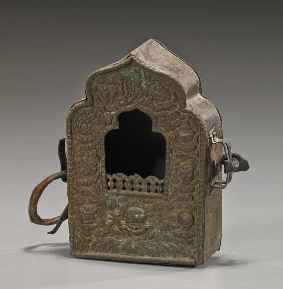 Antique Tibetan Repoussé Traveling Shrine: Antique Tibetan Repoussé Traveling Shrine Antique Tibetan repoussé copper traveling shrine; the front with Buddhist emblems among foliage, loop handles to each side; L: 4 1/4"