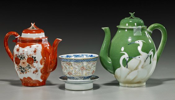 Group of Various Old Asian Porcelains: Group of Various Old Asian Porcelains Group of old porcelains, including 2 Japanese teapots: crane motifs on green ground (cracked), and coral red floral motifs; together with an antique Chinese blue 