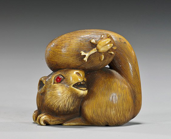 Carved Ivory Netsuke: Squirrel & Insect: Carved Ivory Netsuke: Squirrel & Insect Early 20th Century carved and stained ivory netsuke; of a squirrel with an insect on its tail, inlaid eye, signed in oval reserve