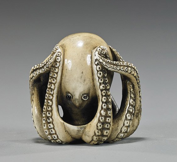 Antique Carved Ivory Netsuke: Octopus: Antique Carved Ivory Netsuke: Octopus Amusing and openwork carved, antique ivory netsuke; of an octopus with all its tentacles reaching up toward its "head", signed, highly realistic, inlaid eyes (one